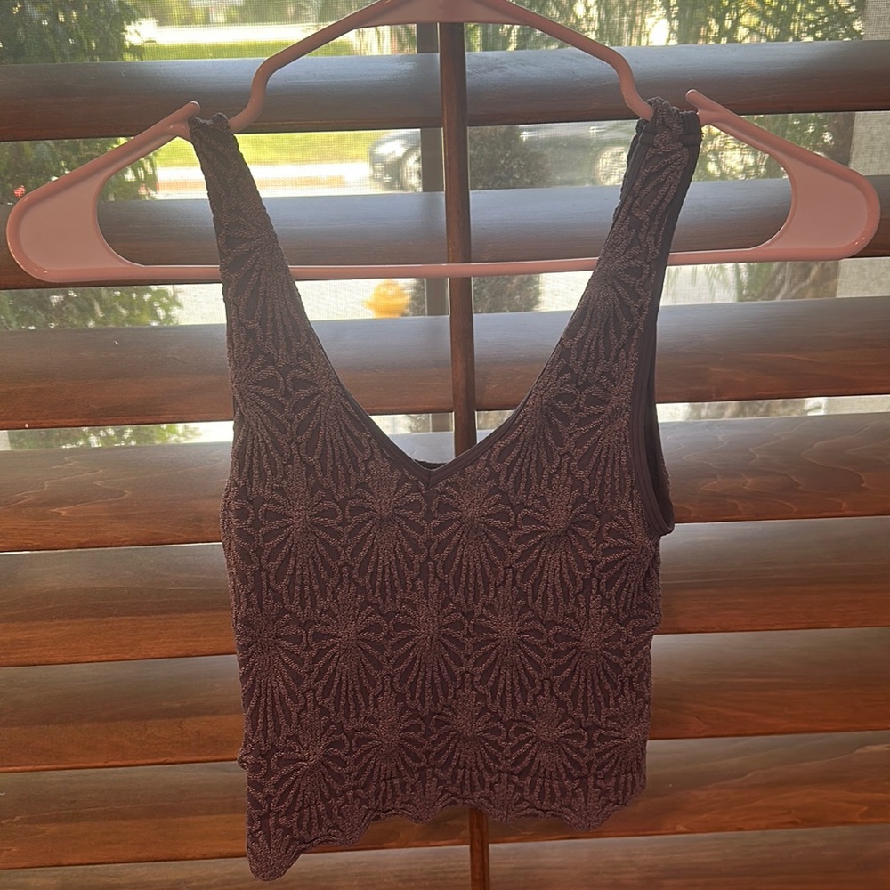 A dark blue top with a pretty texture design